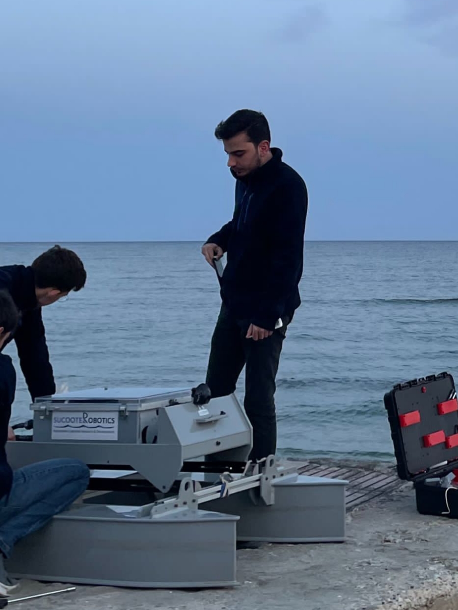 Utku Arslan working with an unmanned surface vehicle
